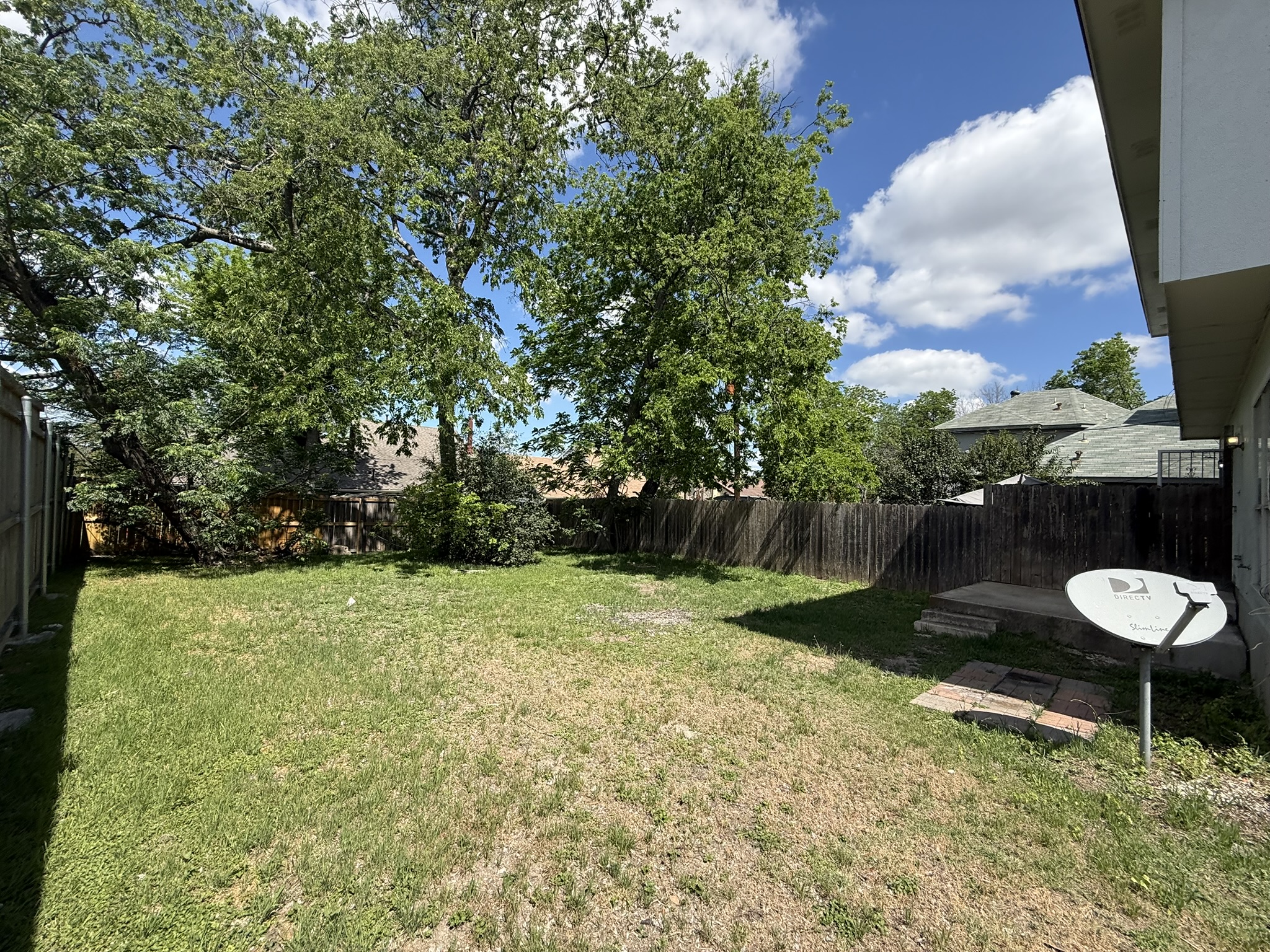 6726 Windrift Way, Unit A Austin, TX 78745 - Photo 27 of 29 a view of a backyard with a trampoline