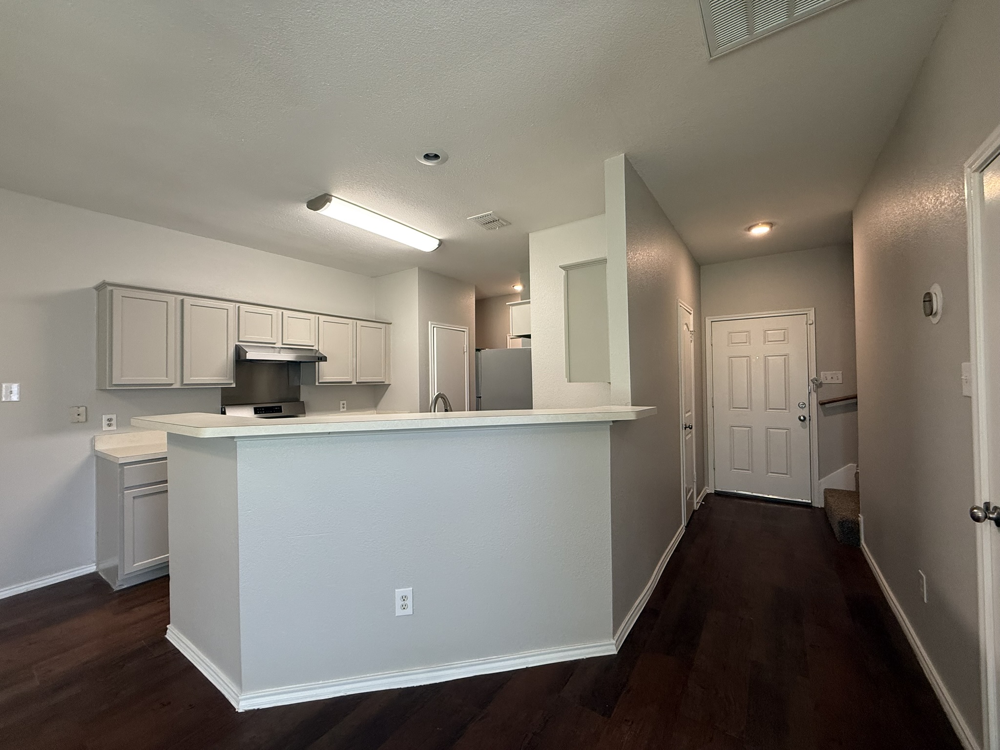 6726 Windrift Way, Unit A Austin, TX 78745 - Photo 5 of 29 a kitchen with stainless steel appliances a refrigerator and a stove top oven