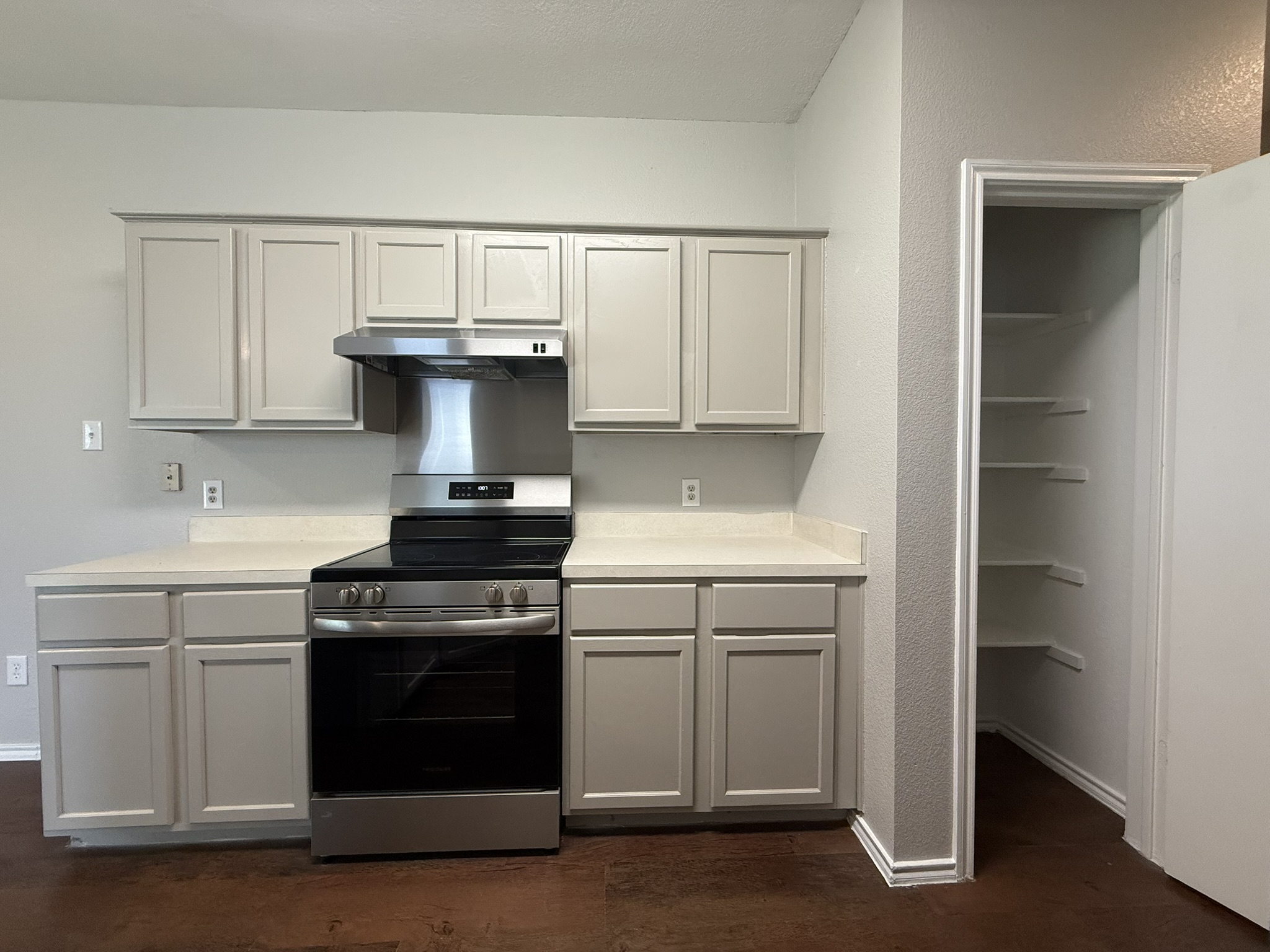 6726 Windrift Way, Unit A Austin, TX 78745 - Photo 8 of 29 a kitchen with a stove and a sink
