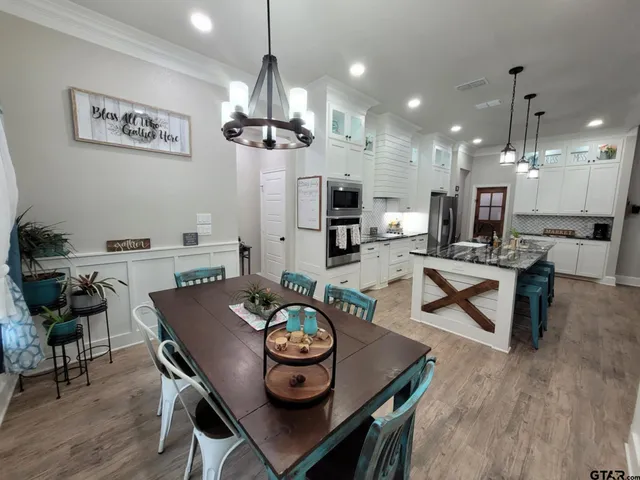a view of a livingroom with a ceiling fan and window