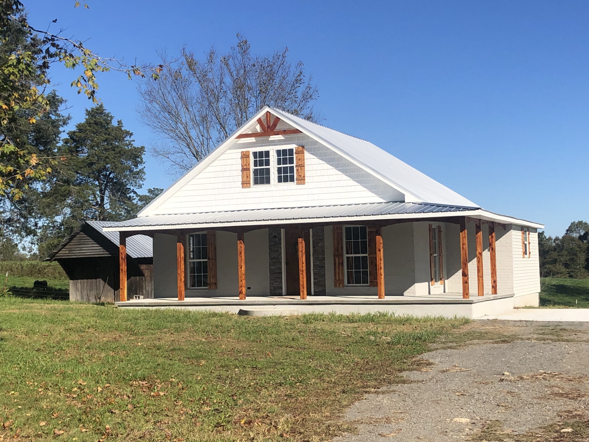 10607 Galen Road Lafayette, TN 37083 - Photo 3 of 33 a front view of a house with a yard