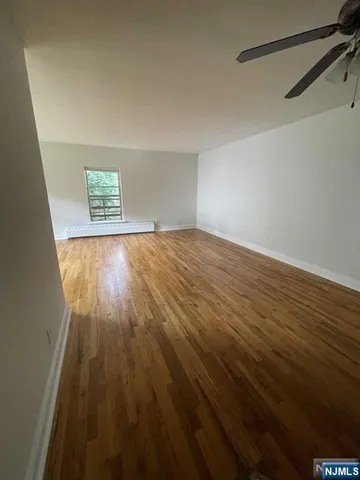 a room with furniture and a refrigerator