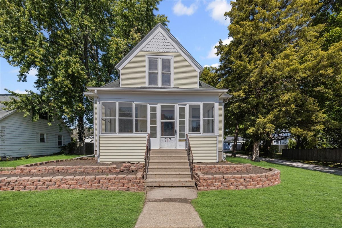 717 Edward Street Sycamore, IL 60178 - Photo 1 of 21 a front view of a house with a yard