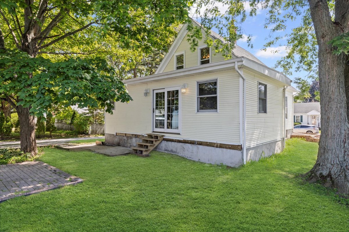 717 Edward Street Sycamore, IL 60178 - Photo 18 of 21 a view of a house with a yard and sitting area