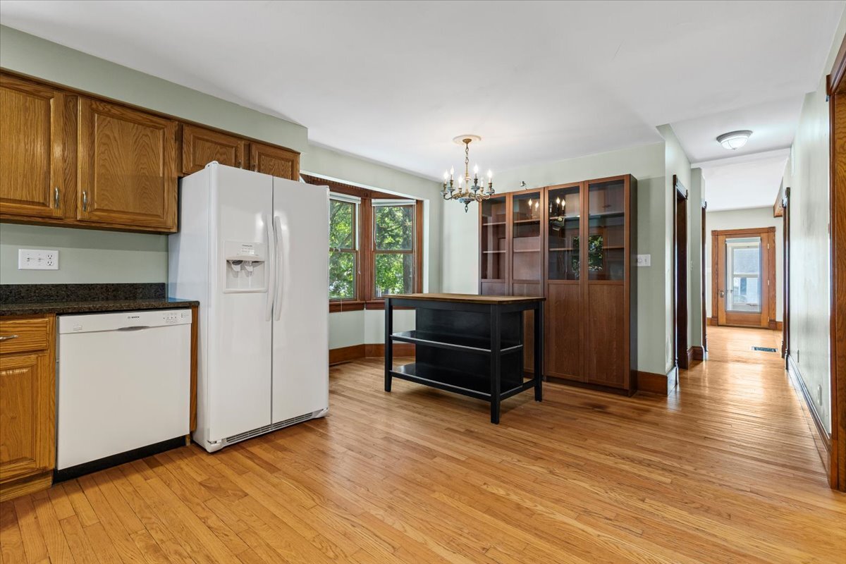 717 Edward Street Sycamore, IL 60178 - Photo 6 of 21 a kitchen with stainless steel appliances granite countertop a refrigerator and a stove top oven