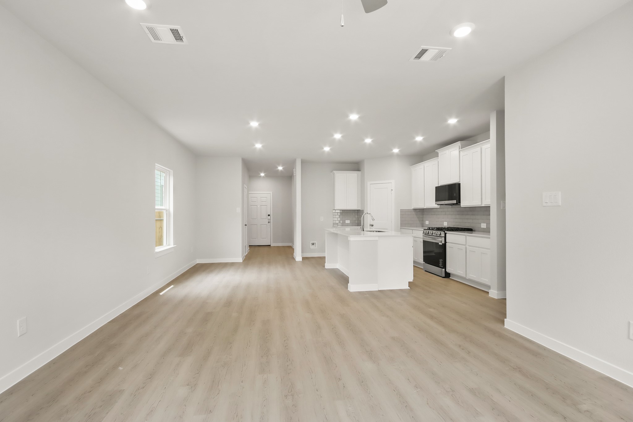 229 Spring Drive Hockley, TX 77447 - Photo 7 of 26 a view of kitchen with wooden floor