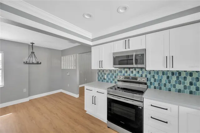 a kitchen with a stove and a microwave