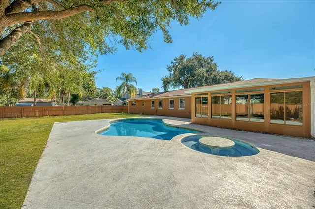 a view of a house with swimming pool