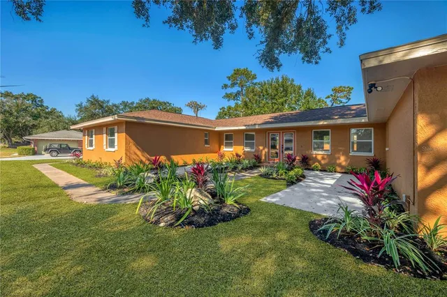 a front view of a house with garden