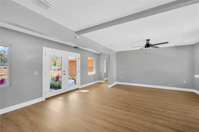 a kitchen with stainless steel appliances granite countertop a refrigerator and a stove
