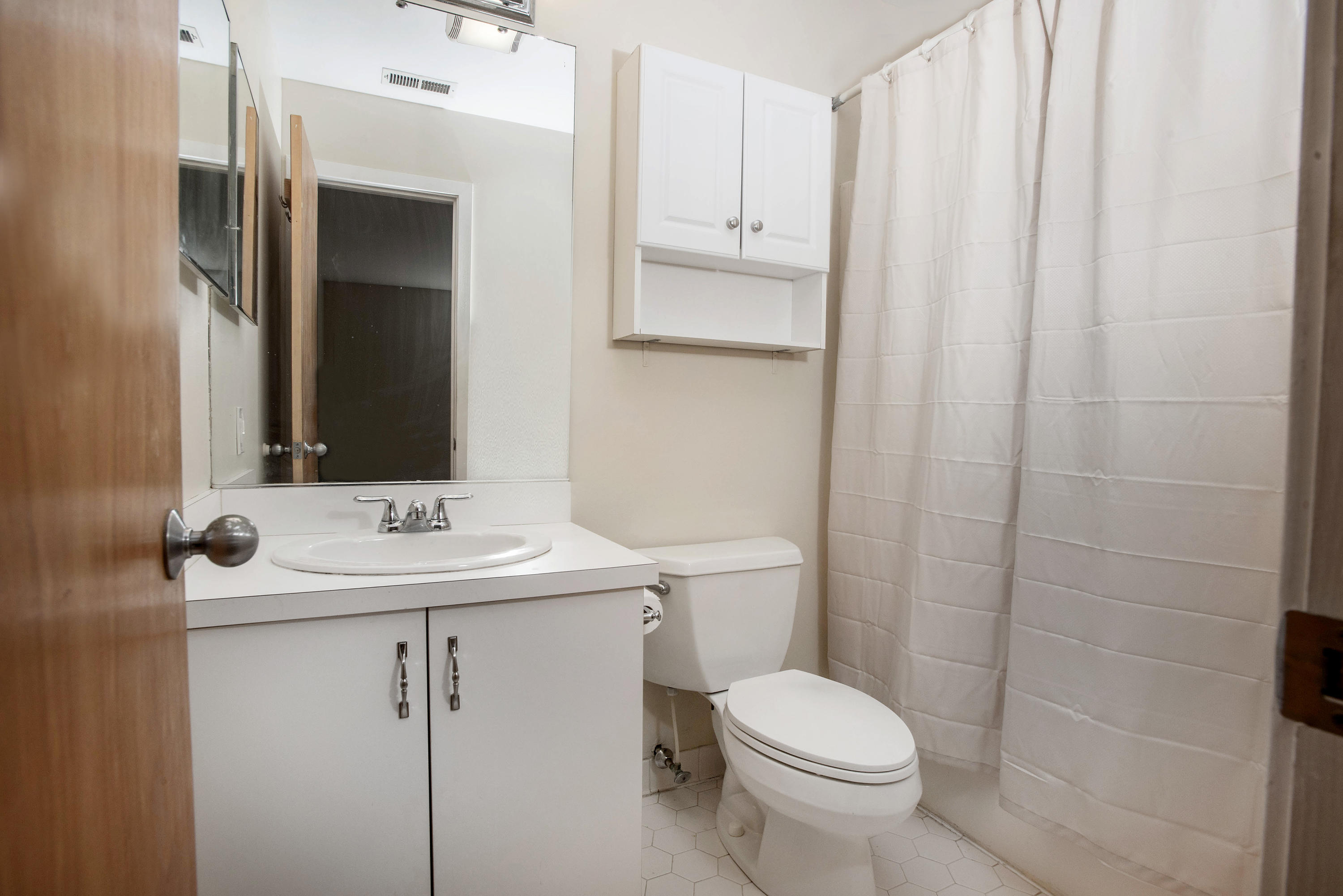 300 Flax Hill Road, Unit 6 Norwalk, CT 06854 - Photo 12 of 18 a bathroom with a sink toilet and mirror