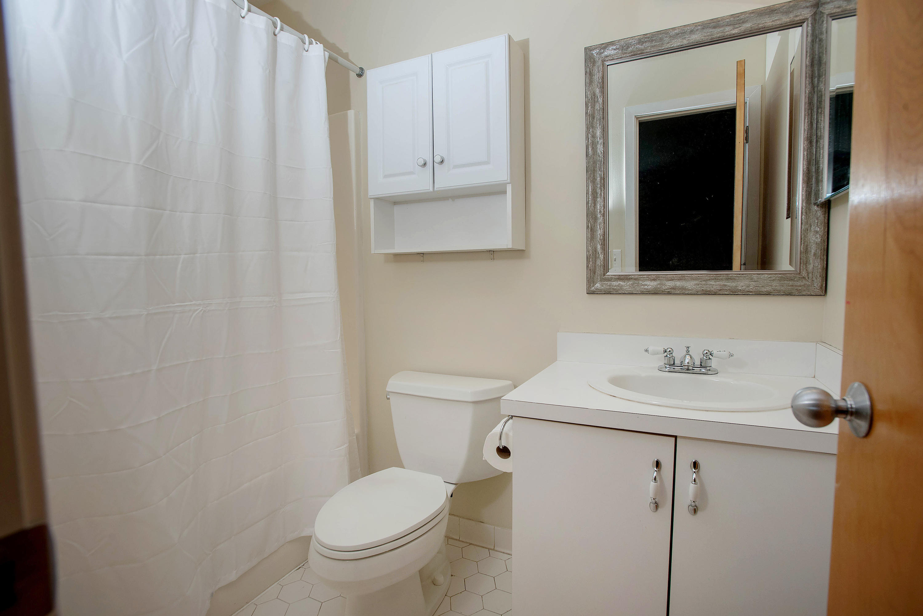 300 Flax Hill Road, Unit 6 Norwalk, CT 06854 - Photo 9 of 18 a bathroom with a toilet sink and mirror