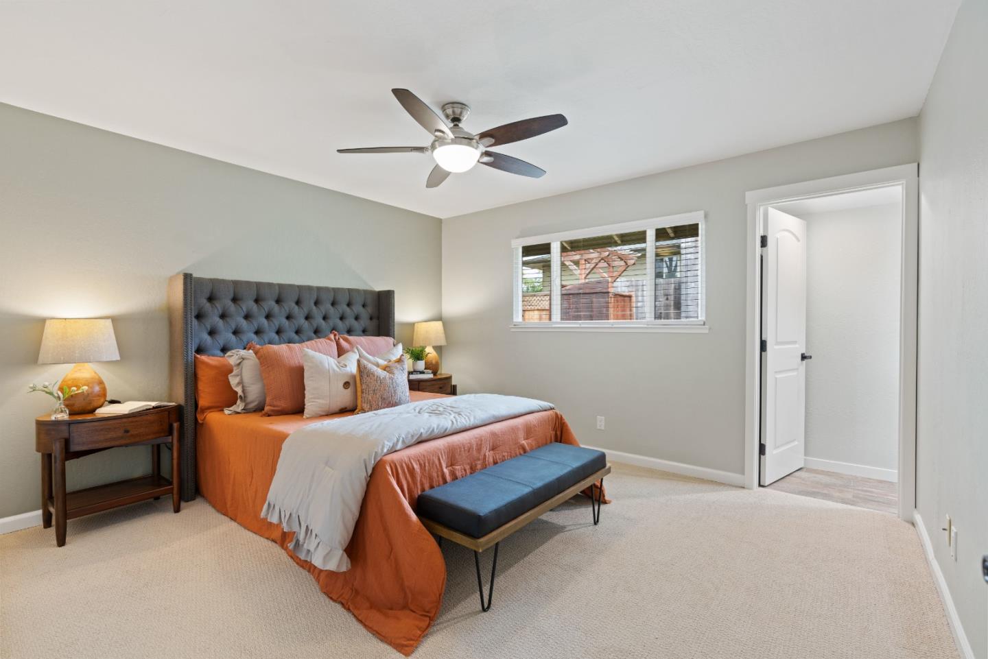 2732 Estates Drive Aptos, CA 95003 - Photo 19 of 63 a bedroom with a bed and a chandelier