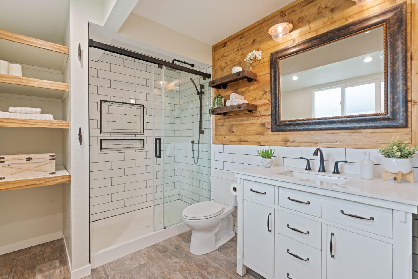2732 Estates Drive Aptos, CA 95003 - Photo 24 of 63 a bathroom with a granite countertop toilet sink and mirror