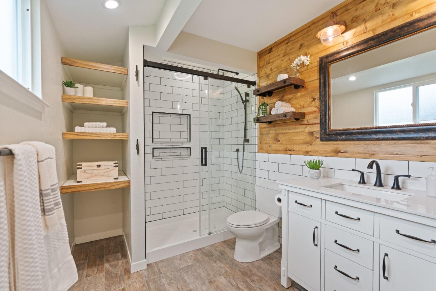 2732 Estates Drive Aptos, CA 95003 - Photo 25 of 63 a bathroom with a toilet sink and mirror