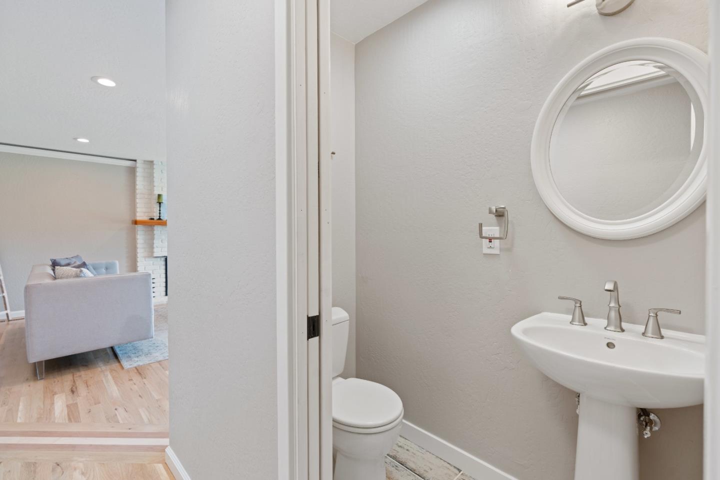 2732 Estates Drive Aptos, CA 95003 - Photo 28 of 63 a bathroom with a sink a toilet and a mirror