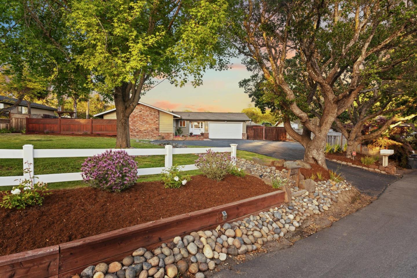 2732 Estates Drive Aptos, CA 95003 - Photo 49 of 63 a view of a backyard with table and chairs potted plants and a large tree
