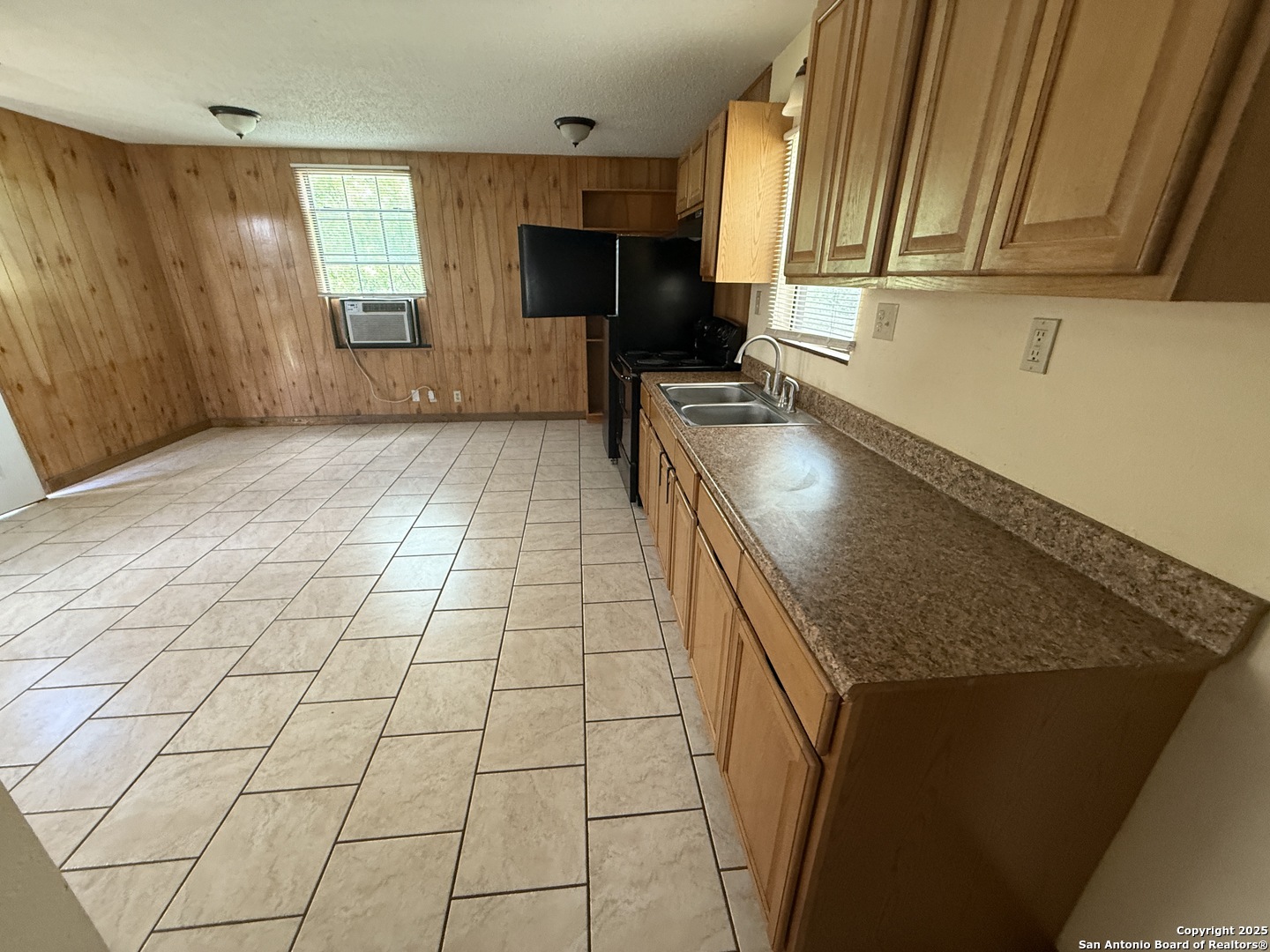13338 Interstate 35 Moore, TX 78057 - Photo 20 of 37 a kitchen with stainless steel appliances granite countertop a sink stove and cabinets