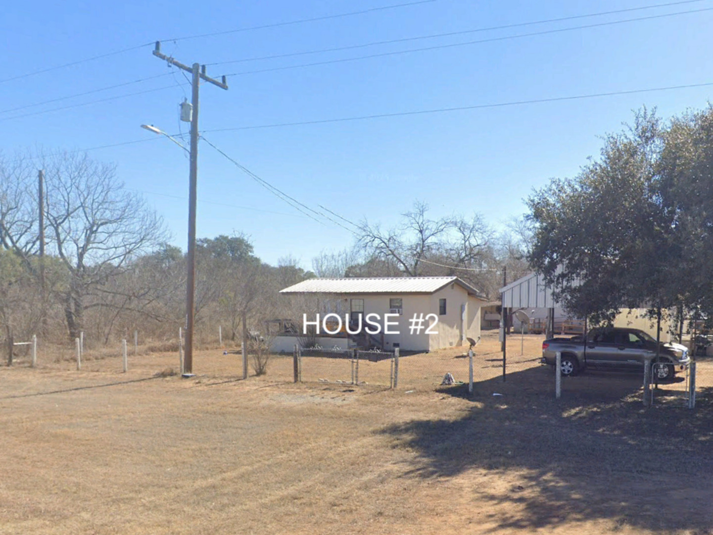 13338 Interstate 35 Moore, TX 78057 - Photo 2 of 37 a sign board on a sidewalk next to a road