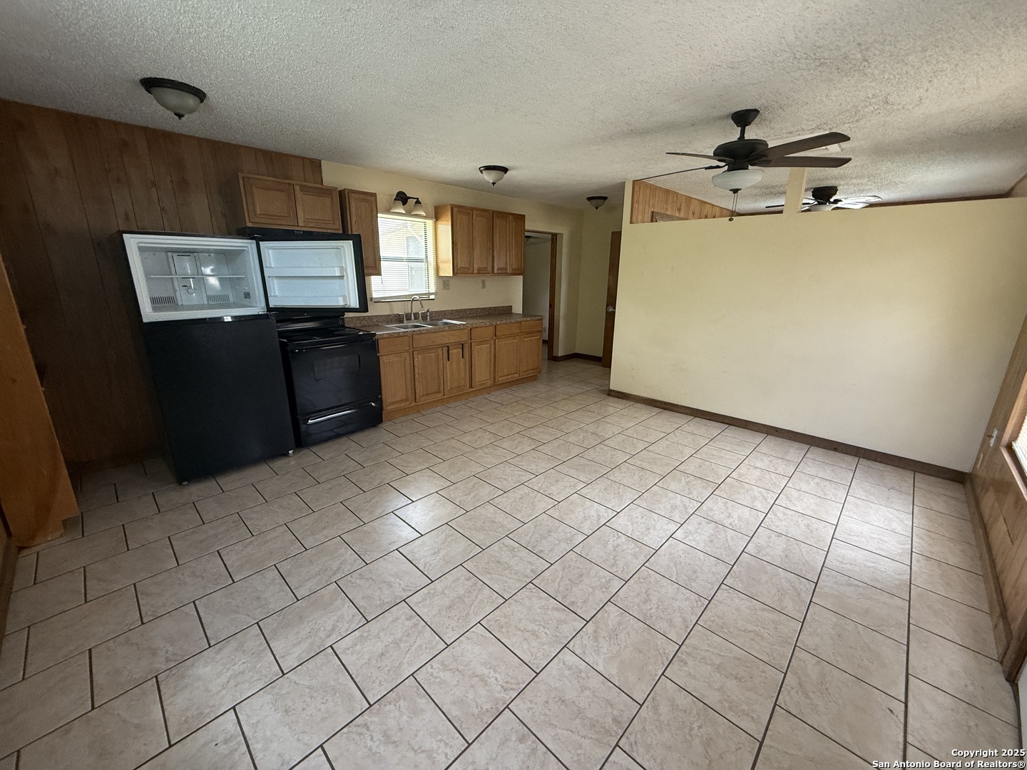 13338 Interstate 35 Moore, TX 78057 - Photo 21 of 37 a kitchen with granite countertop a sink cabinets and appliances