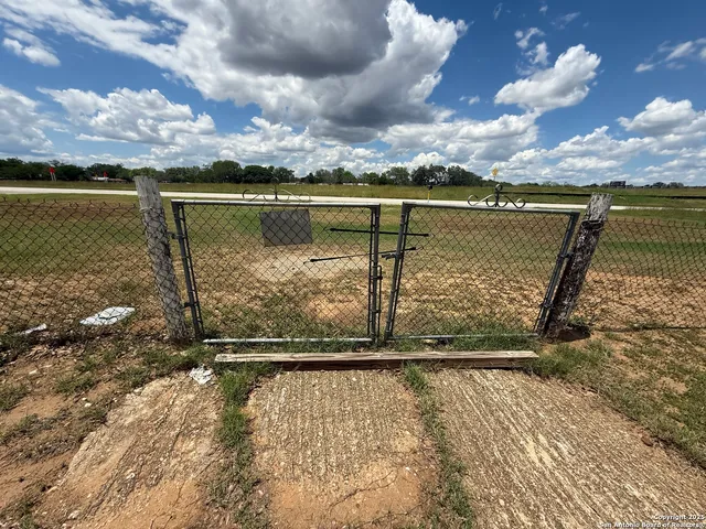 a house with lots of trees in the background