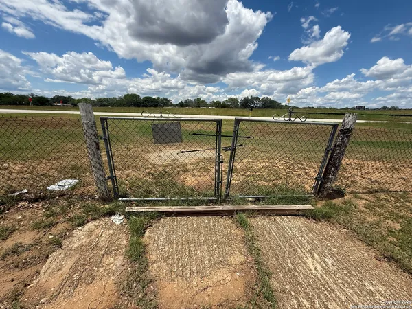 a house with lots of trees in the background