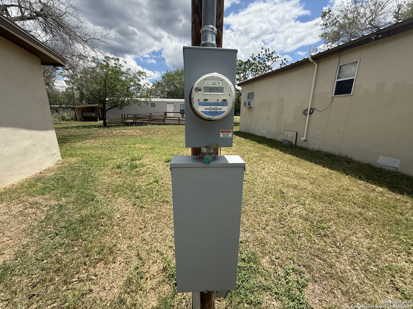 13338 Interstate 35 Moore, TX 78057 - Photo 25 of 37 a view of a fireplace with a large tree in the background