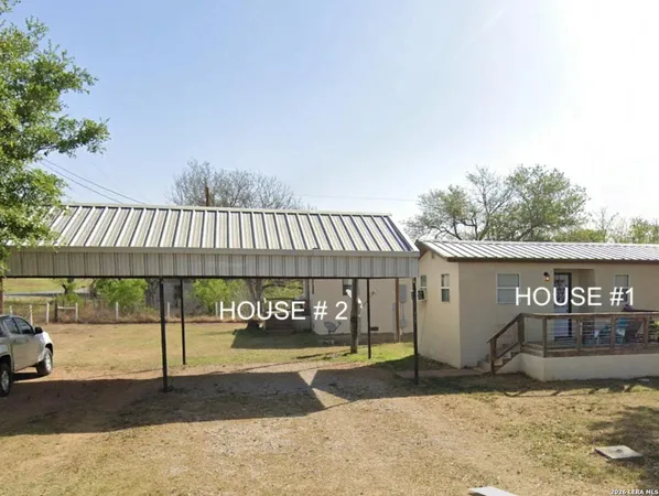 a front view of a house with garage