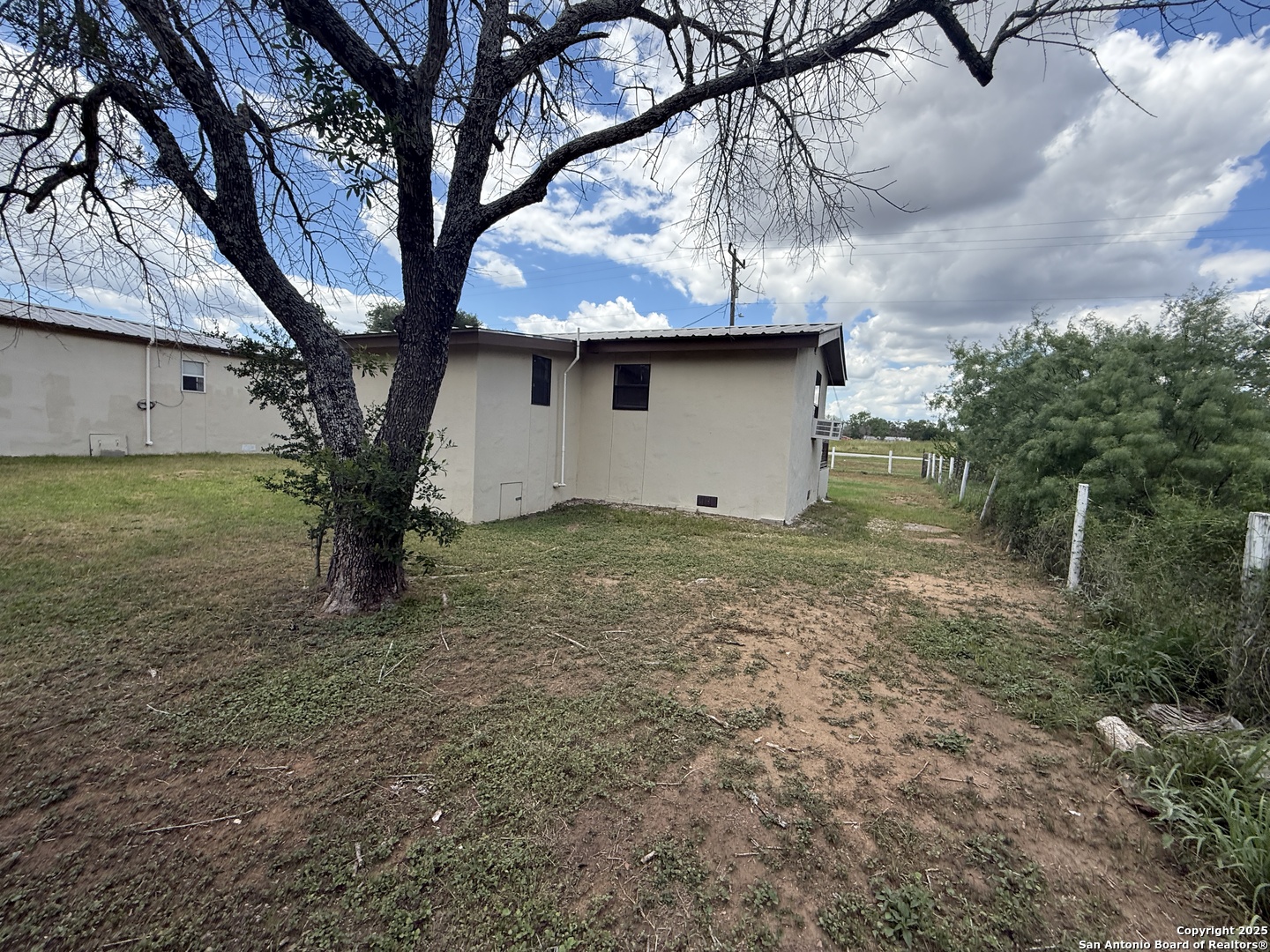 13338 Interstate 35 Moore, TX 78057 - Photo 31 of 37 a view of a tree in the middle of a yard