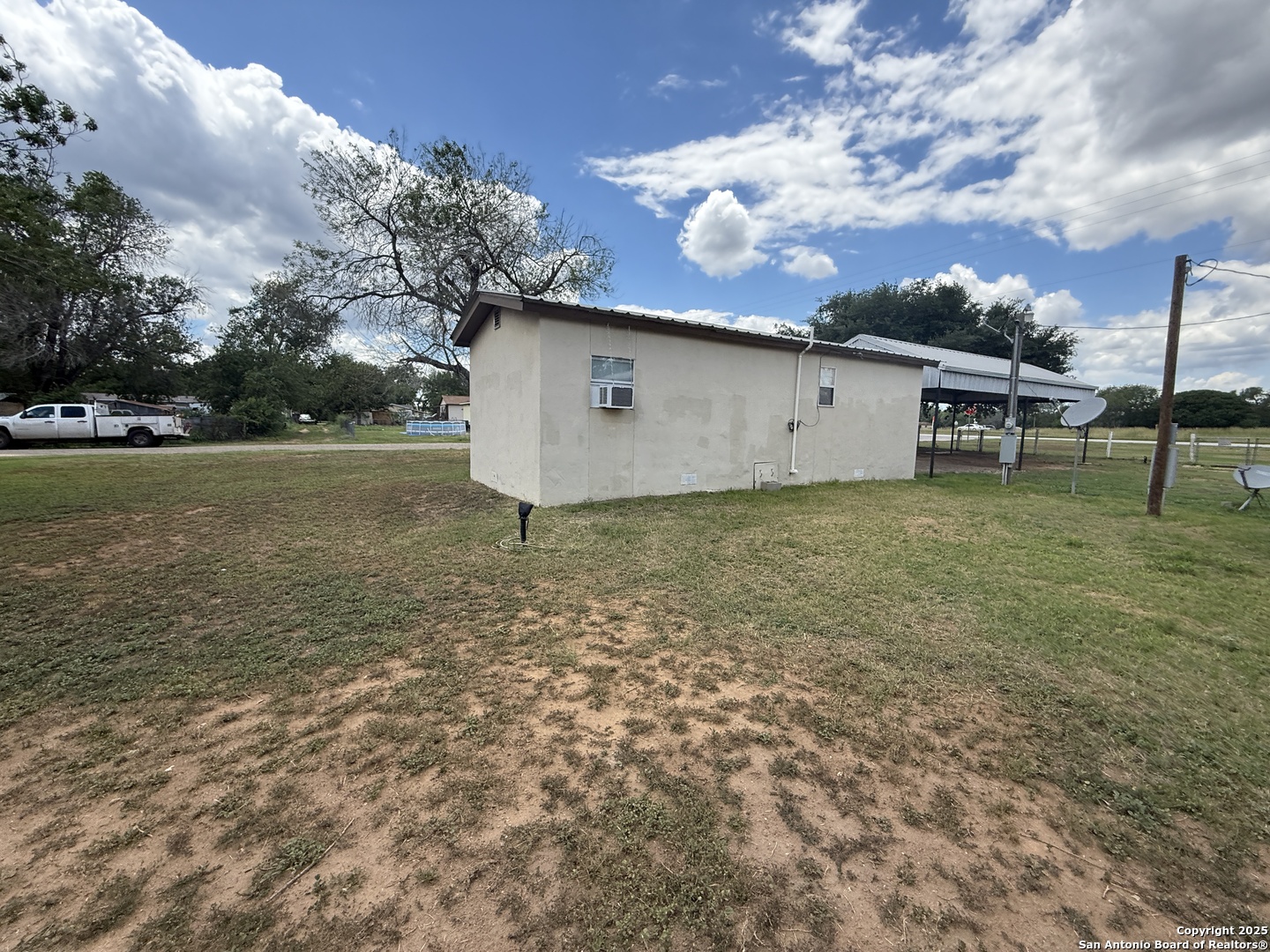 13338 Interstate 35 Moore, TX 78057 - Photo 33 of 37 a view of a backyard with large trees