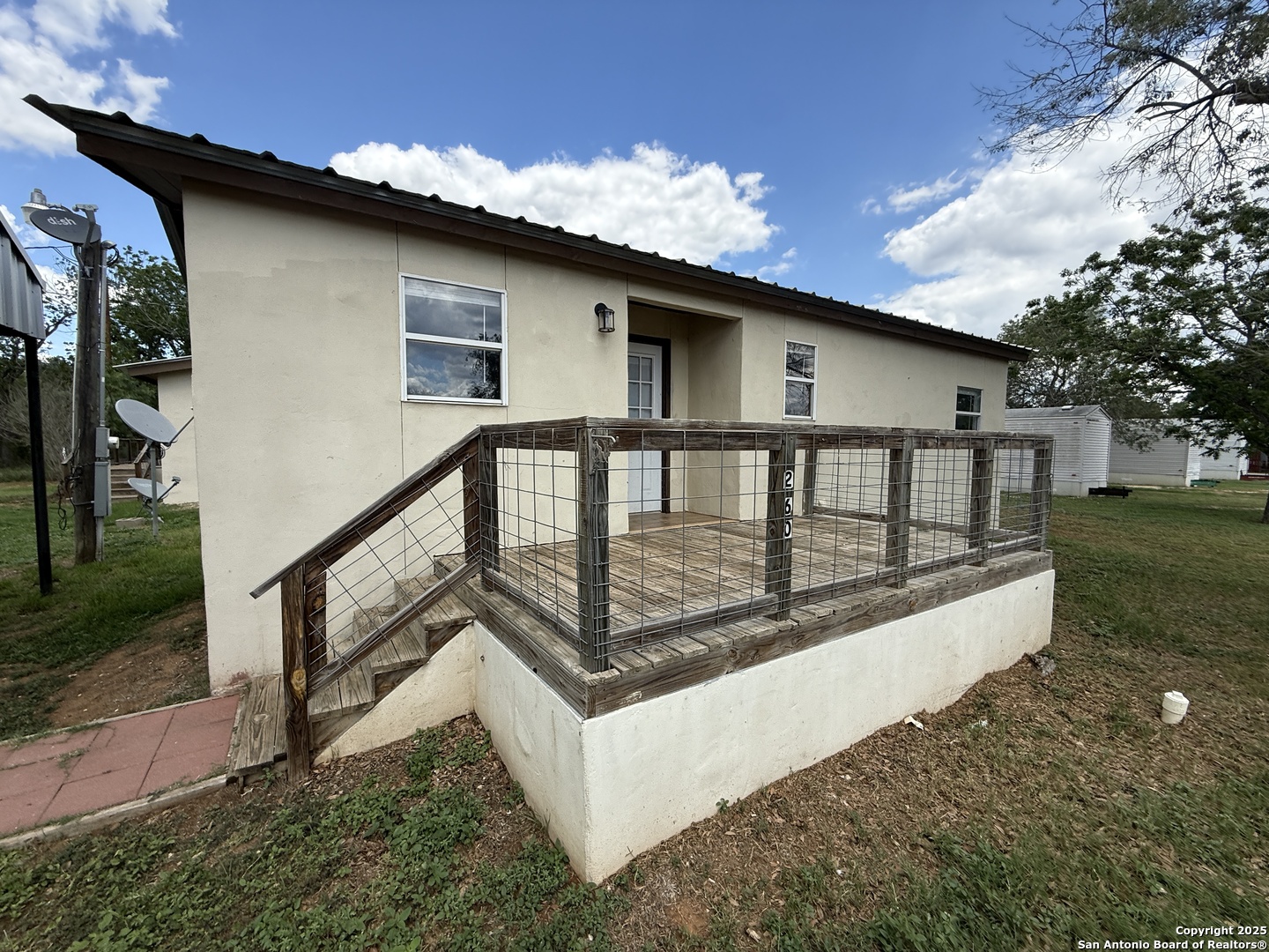 13338 Interstate 35 Moore, TX 78057 - Photo 6 of 37 a view of a house with backyard and sitting area