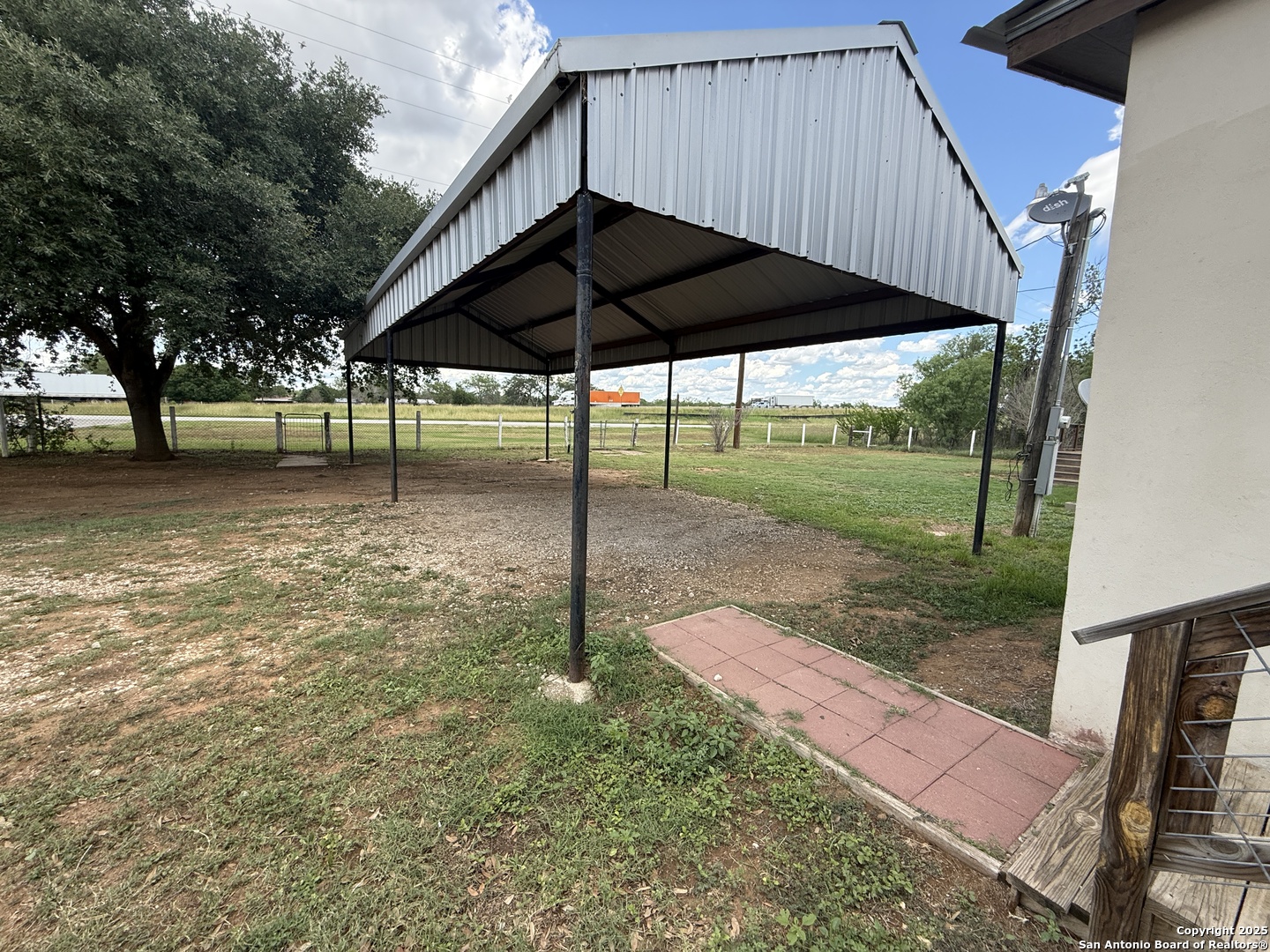 13338 Interstate 35 Moore, TX 78057 - Photo 9 of 37 a backyard of a house with table and chairs