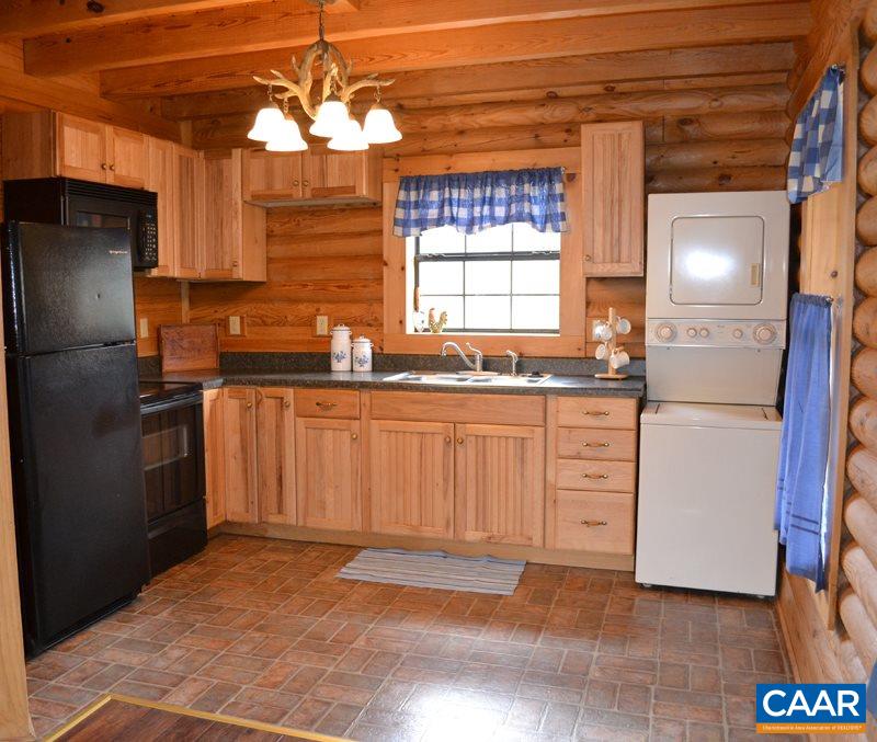 548 Stage Junction Road Columbia, VA 23038 - Photo 3 of 19 a kitchen with a sink stove and refrigerator