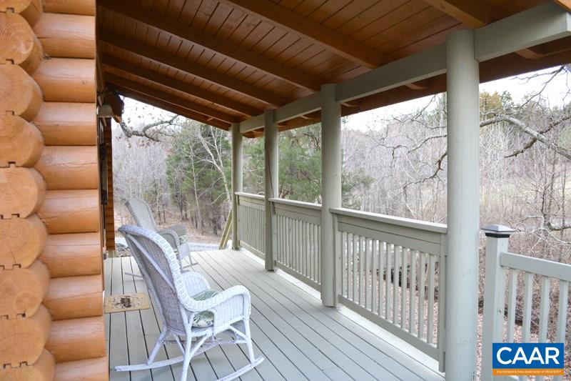 548 Stage Junction Road Columbia, VA 23038 - Photo 9 of 19 a view of a porch with furniture and wooden floor