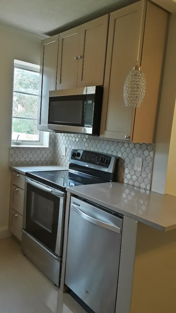 825 West 3rd Street Riviera Beach, FL 33404 - Photo 7 of 29 dishwasher side of kitchen