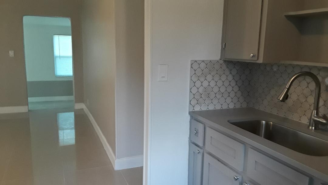 825 West 3rd Street Riviera Beach, FL 33404 - Photo 8 of 29 KITCHEN FAUCET AND LIVING