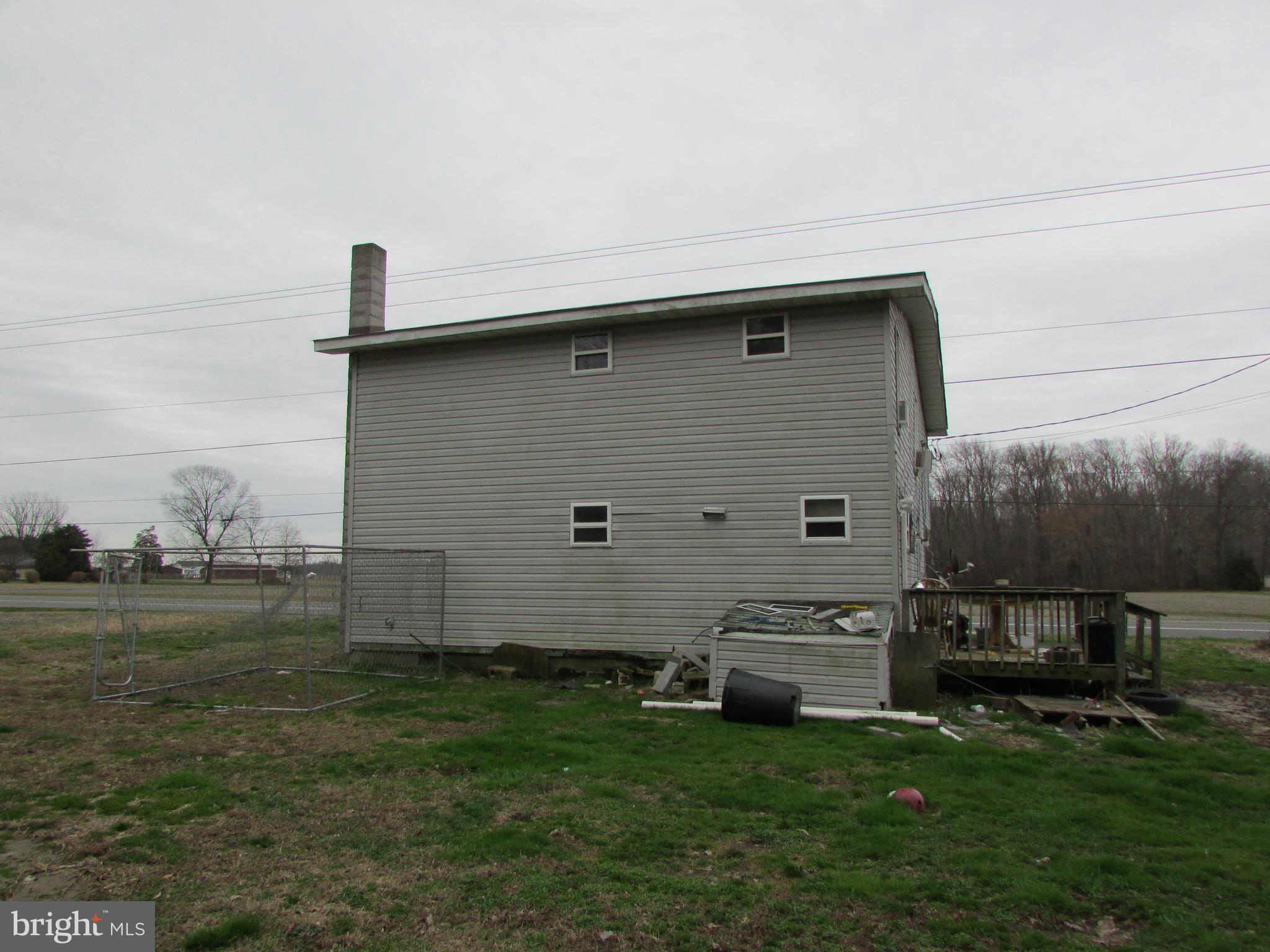 13050 Oakland Road Ridgely, MD 21660 - Photo 11 of 13 Back Yard & Deck to the Side of Home