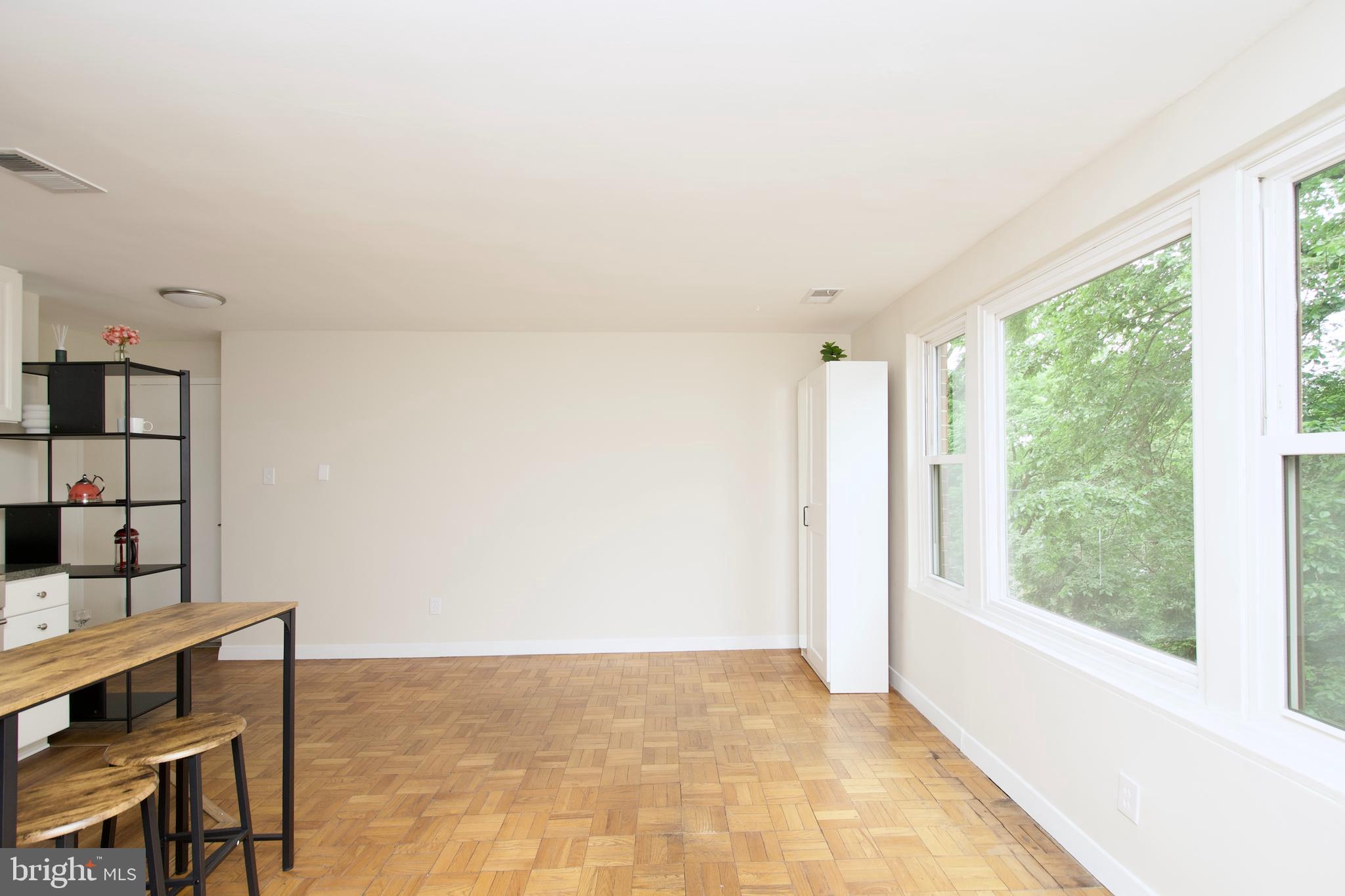 4840 MacArthur Boulevard Northwest, Unit 54 Washington, DC 20007 - Photo 13 of 28 a view of livingroom with furniture and window