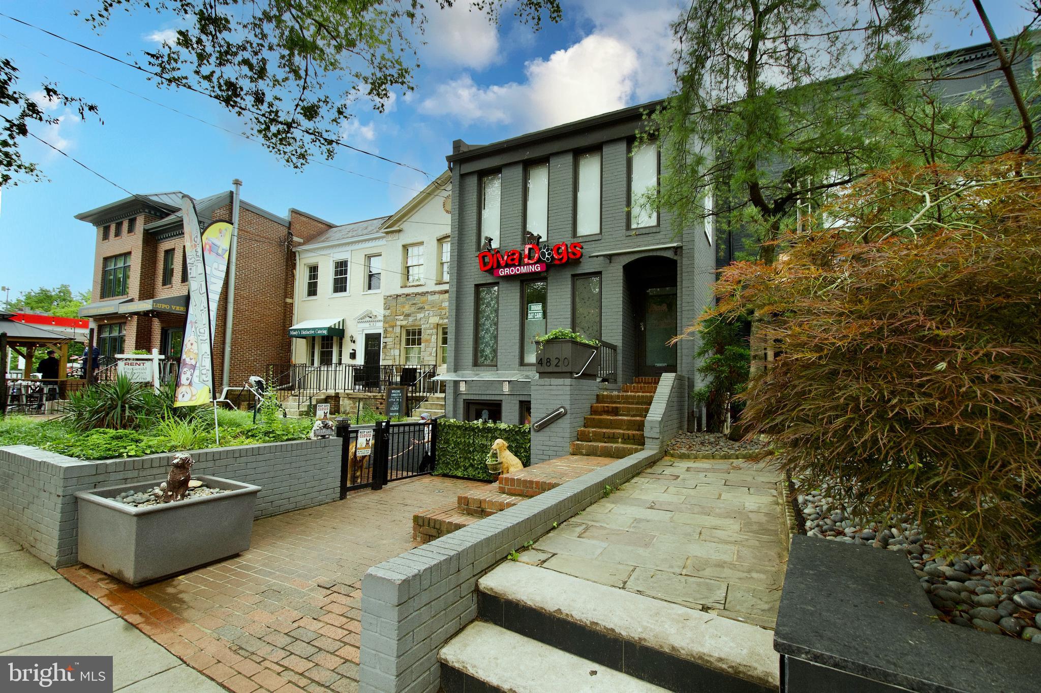 4840 MacArthur Boulevard Northwest, Unit 54 Washington, DC 20007 - Photo 22 of 28 a front view of a house with outdoor seating