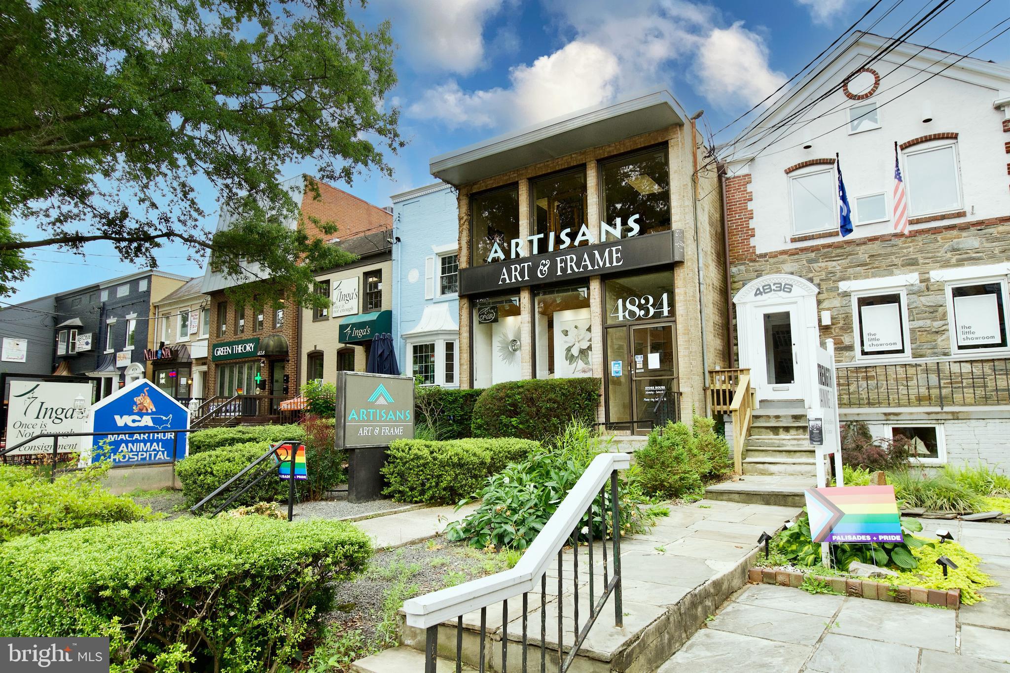 4840 MacArthur Boulevard Northwest, Unit 54 Washington, DC 20007 - Photo 26 of 28 a front view of a residential apartment building with a yard
