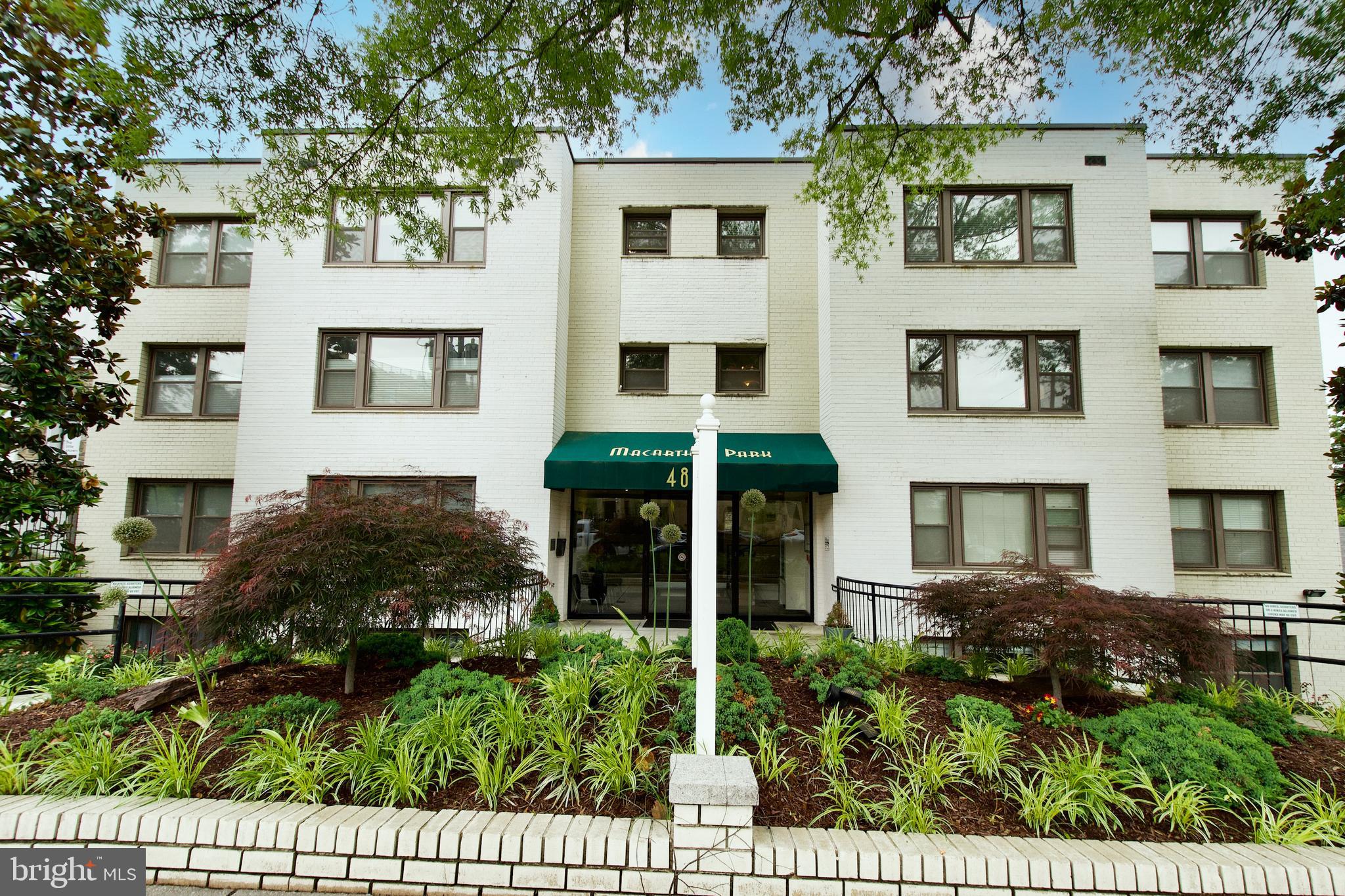 4840 MacArthur Boulevard Northwest, Unit 54 Washington, DC 20007 - Photo 4 of 28 a view of a house with a garden