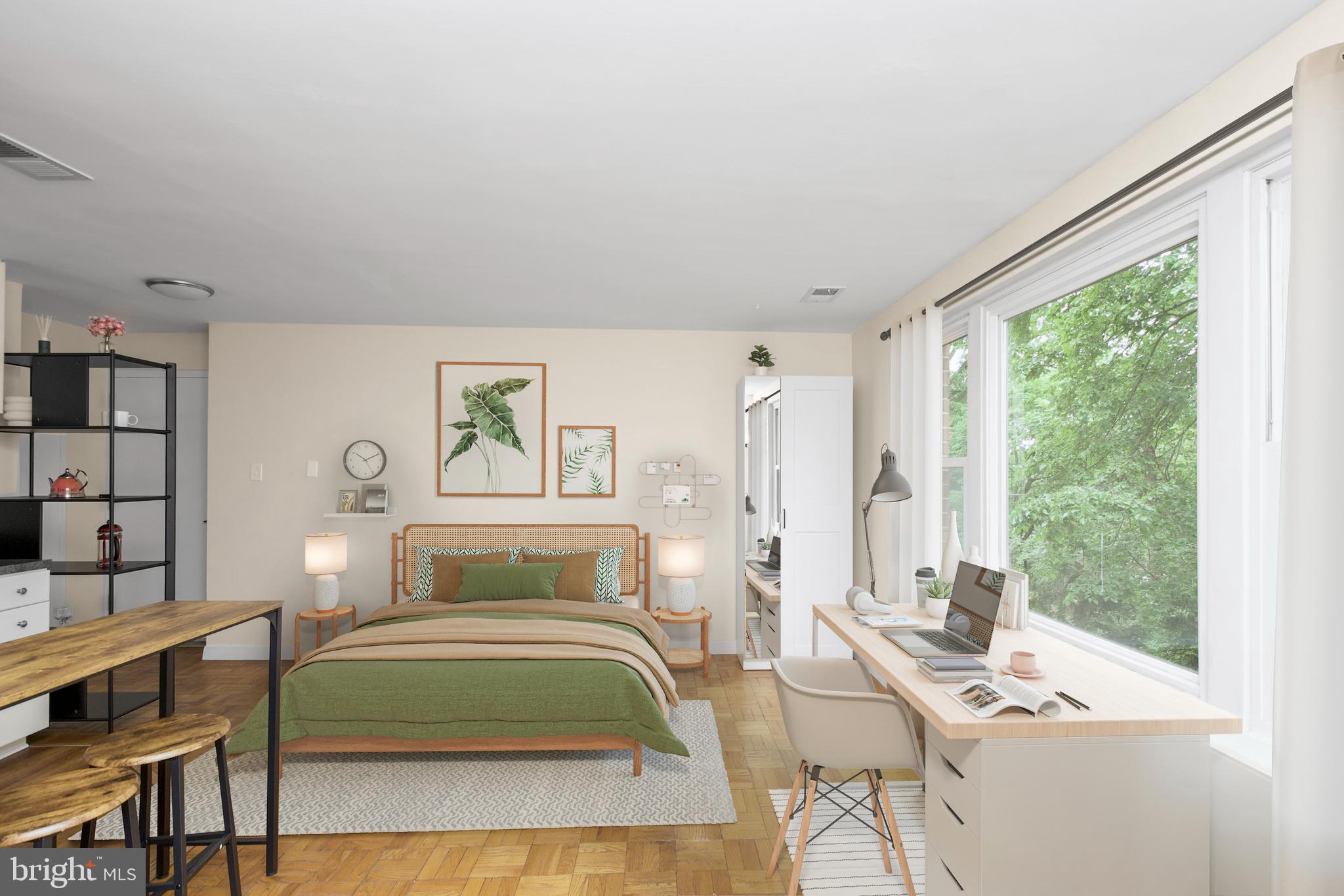 4840 MacArthur Boulevard Northwest, Unit 54 Washington, DC 20007 - Photo 6 of 28 a bedroom with a bed and a large window