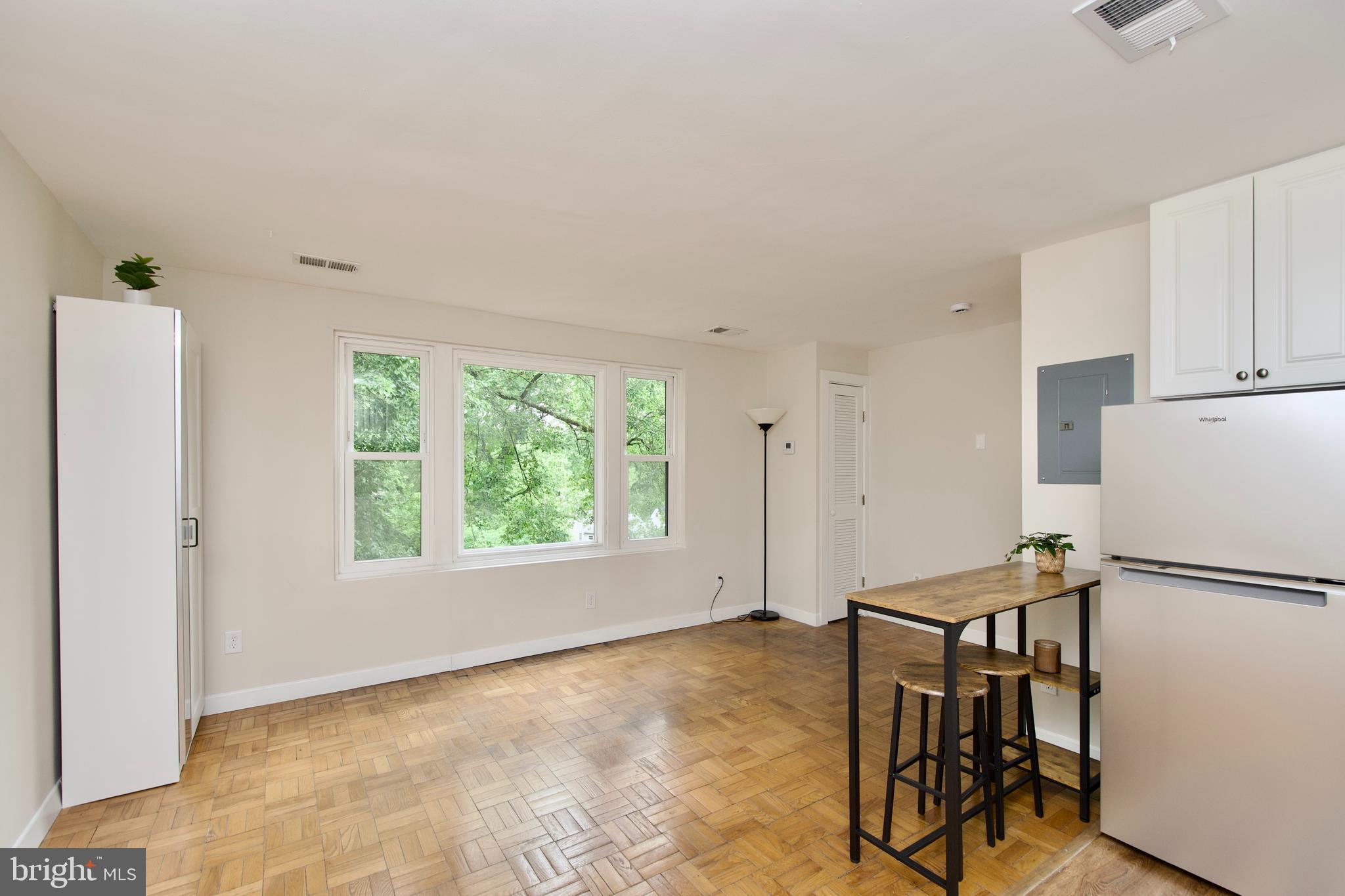 4840 MacArthur Boulevard Northwest, Unit 54 Washington, DC 20007 - Photo 9 of 28 a view of kitchen with furniture and a refrigerator