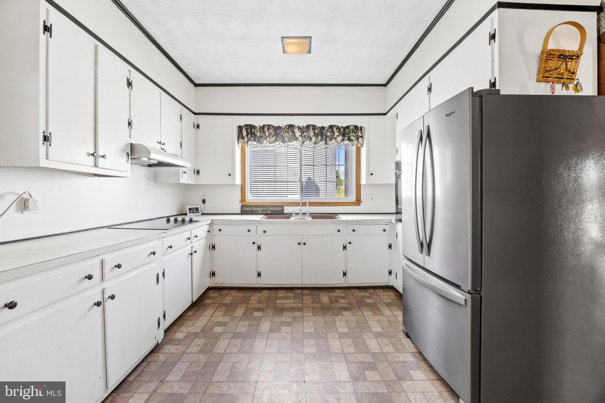 4071 Kabletown Road Charles Town, WV 25414 - Photo 19 of 29 a kitchen with granite countertop white cabinets and refrigerator