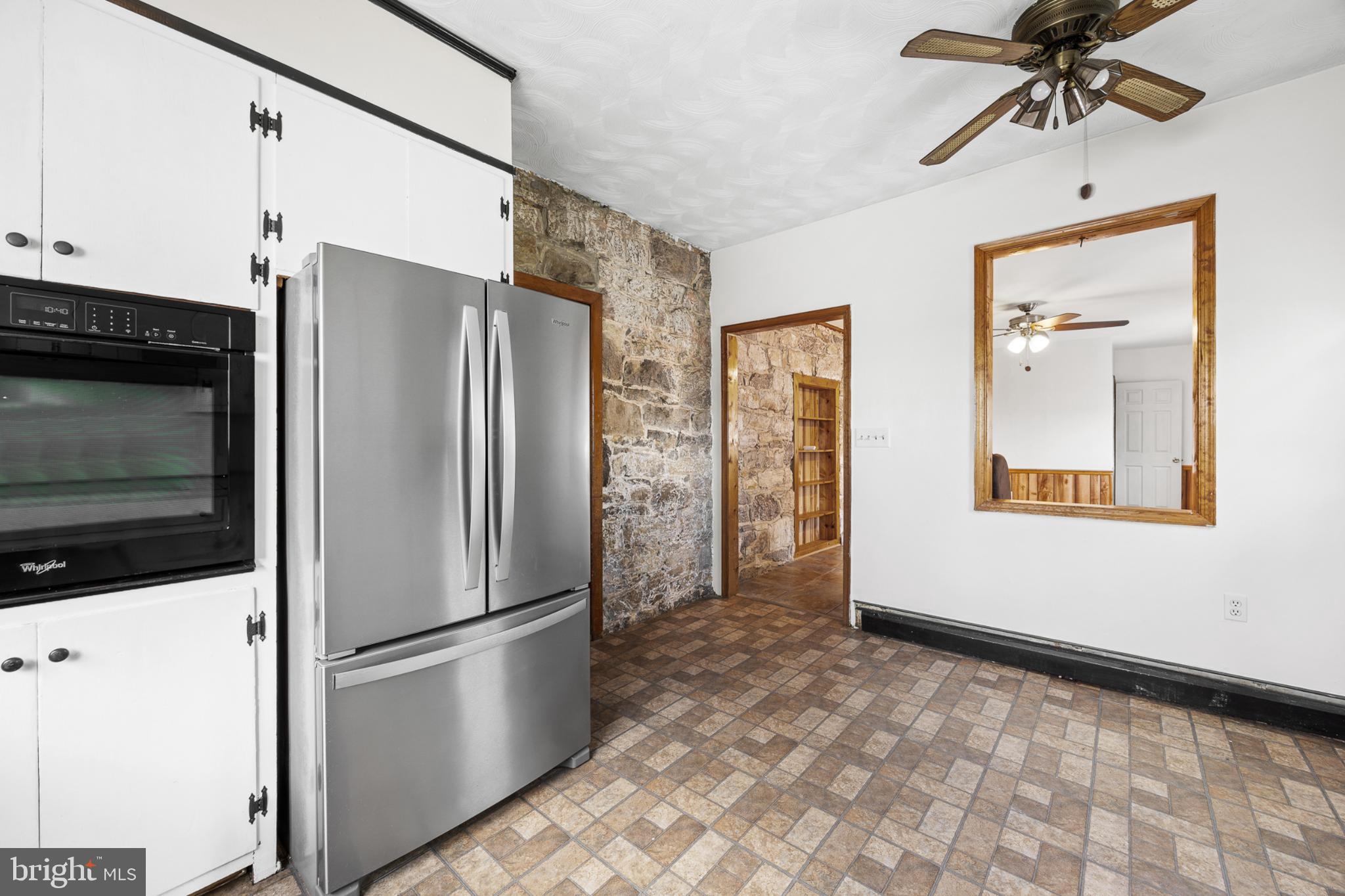 4071 Kabletown Road Charles Town, WV 25414 - Photo 21 of 29 a kitchen with stainless steel appliances a refrigerator and a window