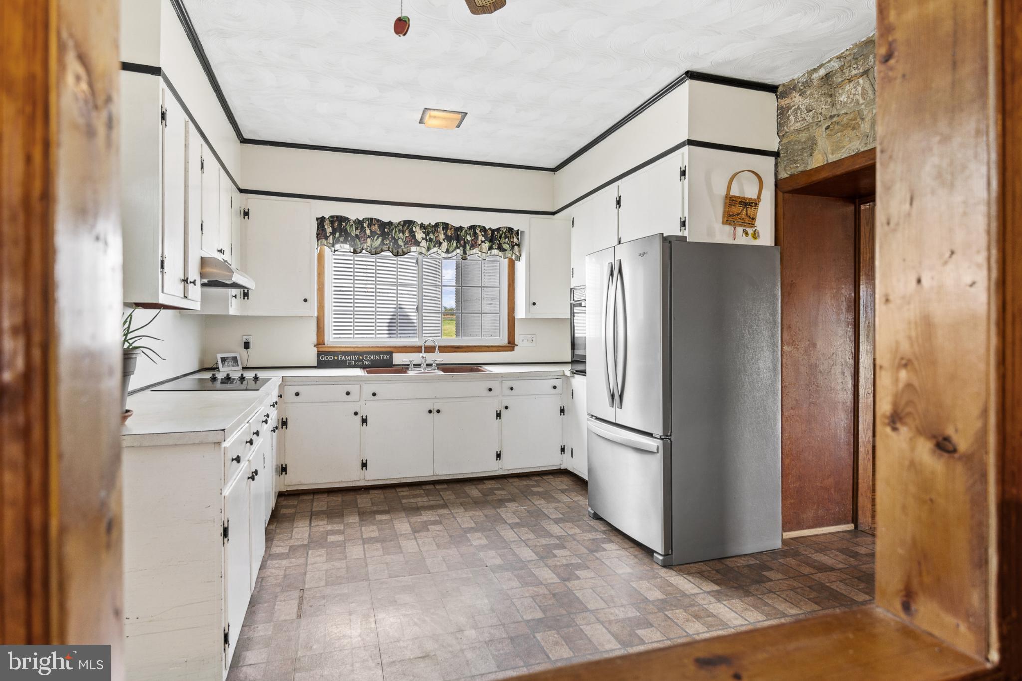 4071 Kabletown Road Charles Town, WV 25414 - Photo 22 of 29 a kitchen with stainless steel appliances a refrigerator sink and cabinets