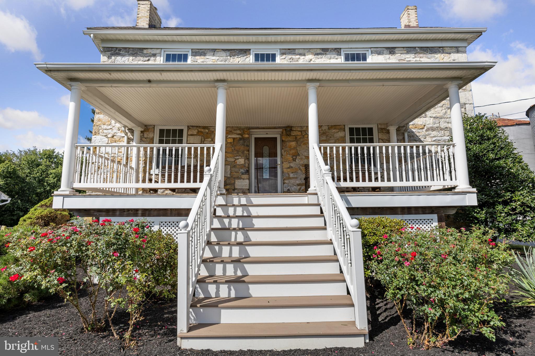 4071 Kabletown Road Charles Town, WV 25414 - Photo 3 of 29 a view of a porch with a bench