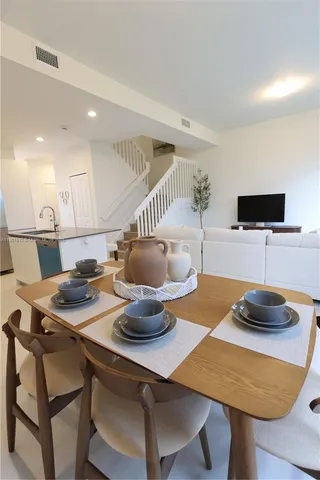 a kitchen with a table and a stove