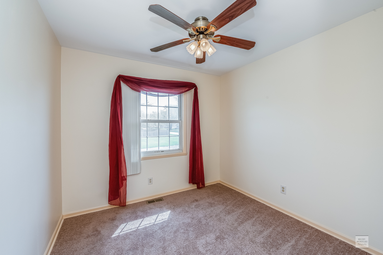 1860 Nottingham Drive Aurora, IL 60505 - Photo 12 of 22 an empty room with windows and fan