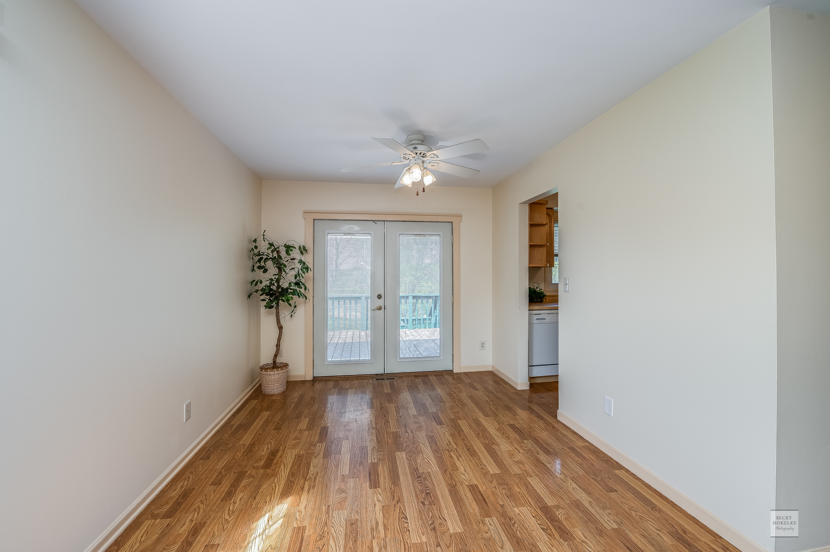 1860 Nottingham Drive Aurora, IL 60505 - Photo 6 of 22 wooden floor in an empty room with a window